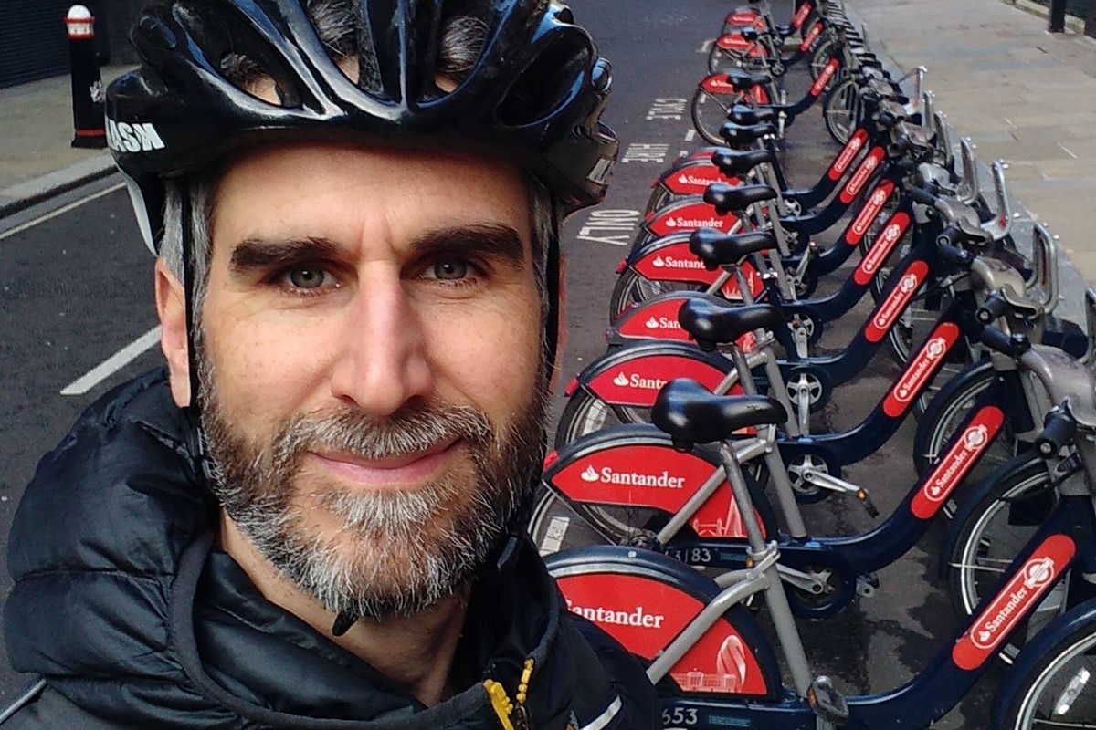 Photo of Andy in front of a Santander Cycles dock
